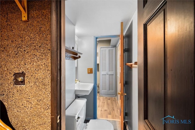 6005 Bahiamar Rd, Toledo, OH 43611 - bathroom featuring a sink and wood finished floors