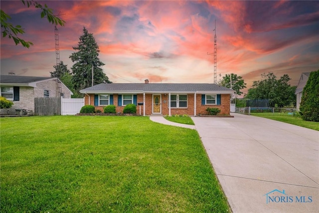 6005 Bahiamar Rd, Toledo, OH 43611 - single story home featuring driveway, brick siding, and a chimney