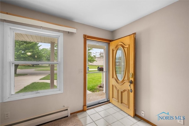 6005 Bahiamar Rd, Toledo, OH 43611 - entrance foyer with baseboard heating, healthy amount of natural light, and light tile patterned flooring