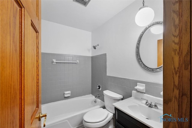 6005 Bahiamar Rd, Toledo, OH 43611 - full bath featuring tile walls, vanity, shower / bath combination, and wainscoting