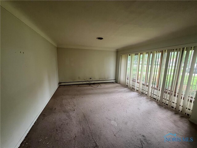 1035 Cherry St, Perrysburg, OH 43551 - unfurnished room featuring a baseboard heating unit and carpet floors
