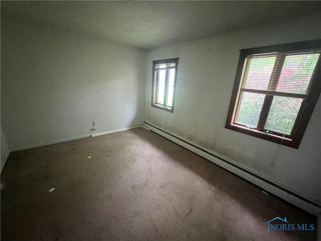 1035 Cherry St, Perrysburg, OH 43551 - unfurnished room featuring a baseboard heating unit and baseboards