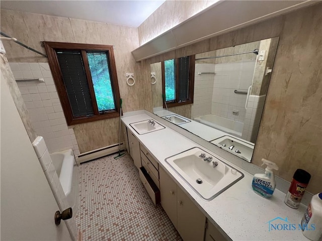 1035 Cherry St, Perrysburg, OH 43551 - full bathroom with baseboard heating, double vanity, tile patterned flooring, washtub / shower combination, and separate washer and dryer
