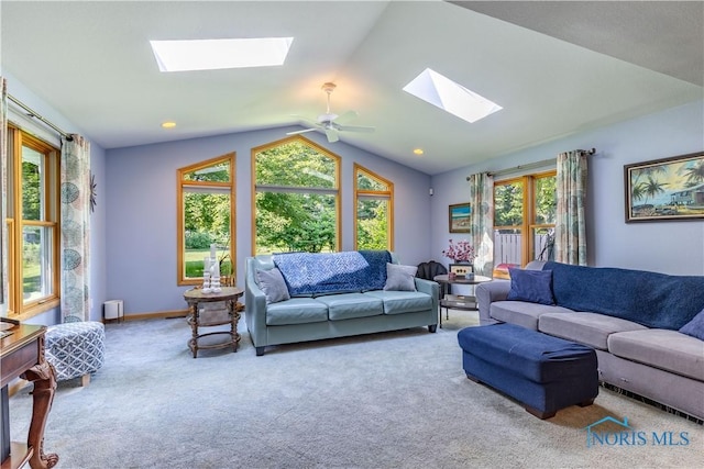 5868 Winslow Rd, Whitehouse, OH 43571 - living area with a skylight, vaulted ceiling, carpet, and a ceiling fan