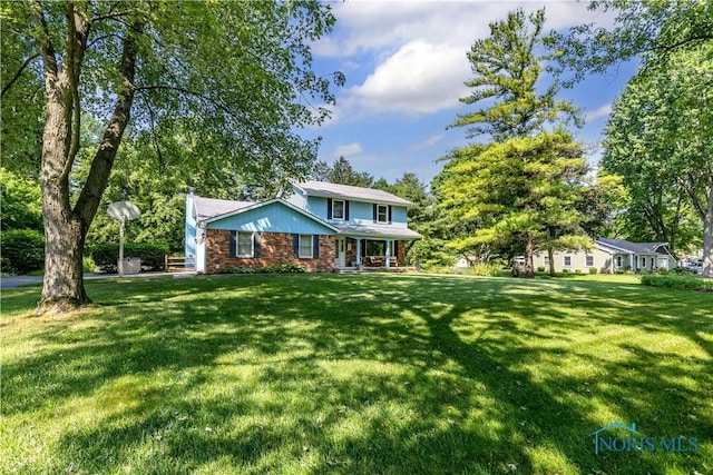 5868 Winslow Rd, Whitehouse, OH 43571 - traditional-style home featuring a front yard and covered porch