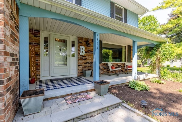 5868 Winslow Rd, Whitehouse, OH 43571 - view of exterior entry featuring covered porch and brick siding