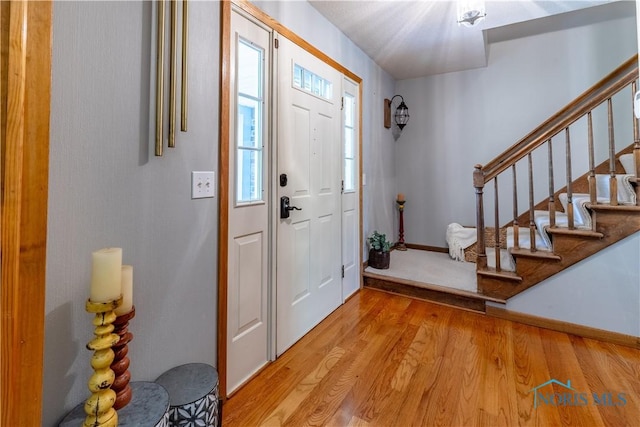5868 Winslow Rd, Whitehouse, OH 43571 - foyer with light wood finished floors and stairway