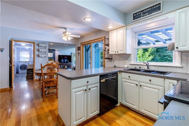 5868 Winslow Rd, Whitehouse, OH 43571 - kitchen featuring washer / dryer, black dishwasher, a peninsula, light wood-style floors, and recessed lighting