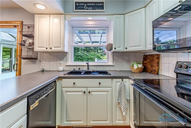 5868 Winslow Rd, Whitehouse, OH 43571 - kitchen featuring black appliances, backsplash, and white cabinetry