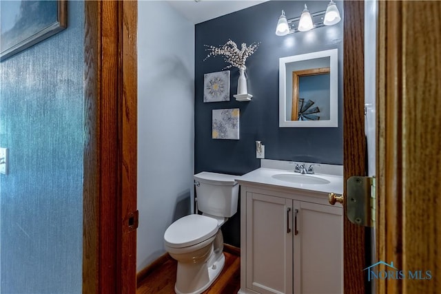 5868 Winslow Rd, Whitehouse, OH 43571 - half bathroom featuring vanity and wood finished floors