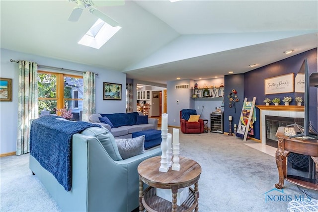 5868 Winslow Rd, Whitehouse, OH 43571 - living area featuring carpet floors, lofted ceiling, a skylight, and ceiling fan