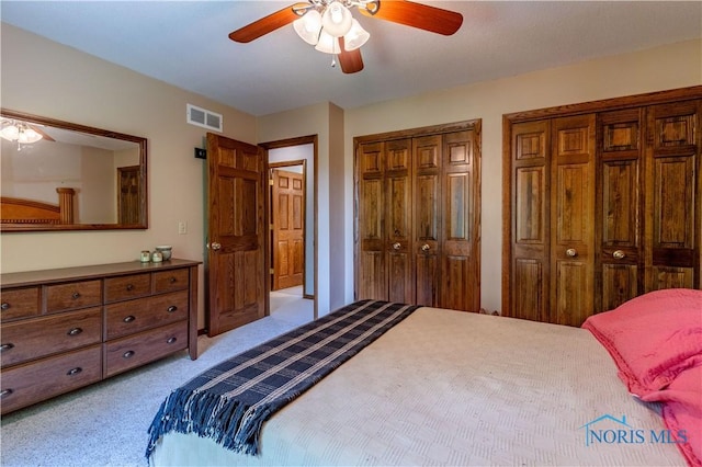 5868 Winslow Rd, Whitehouse, OH 43571 - bedroom featuring multiple closets, light carpet, and ceiling fan
