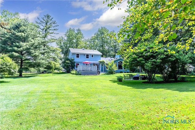 5868 Winslow Rd, Whitehouse, OH 43571 - view of grassy yard with a deck