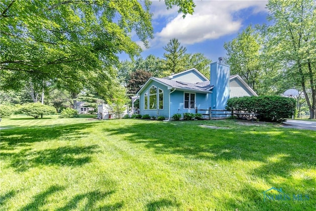 5868 Winslow Rd, Whitehouse, OH 43571 - view of front of house with a chimney and a front yard