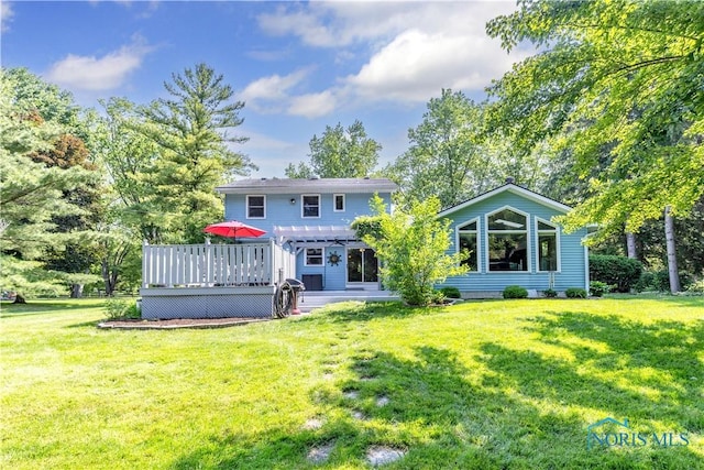 5868 Winslow Rd, Whitehouse, OH 43571 - back of house with a wooden deck, a pergola, and a lawn