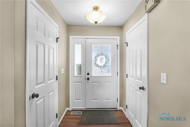 740 Tarra Oaks Dr, Findlay, OH 45840 - entryway with dark wood-style floors