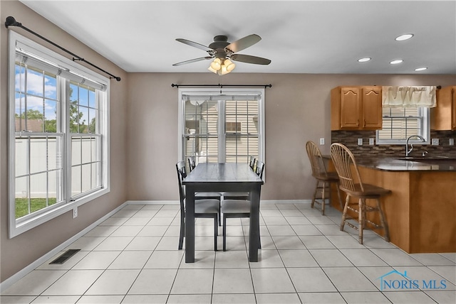740 Tarra Oaks Dr, Findlay, OH 45840 - dining room featuring healthy amount of natural light, a ceiling fan, recessed lighting, and light tile patterned flooring