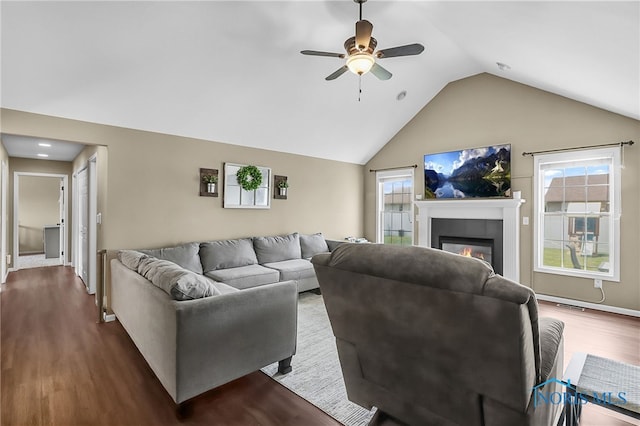 740 Tarra Oaks Dr, Findlay, OH 45840 - living room featuring lofted ceiling, dark wood finished floors, ceiling fan, and a glass covered fireplace