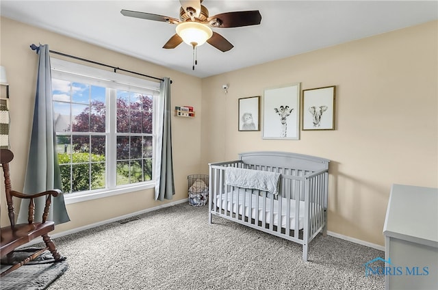 740 Tarra Oaks Dr, Findlay, OH 45840 - bedroom featuring carpet flooring, a nursery area, and ceiling fan