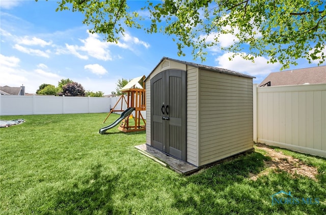 740 Tarra Oaks Dr, Findlay, OH 45840 - view of shed with a fenced backyard and a playground