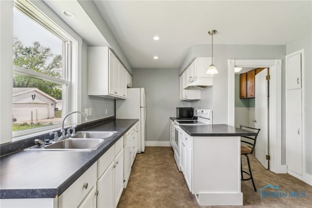 118 Allen Ave, Findlay, OH 45840 - kitchen featuring white appliances, white cabinets, dark countertops, and recessed lighting
