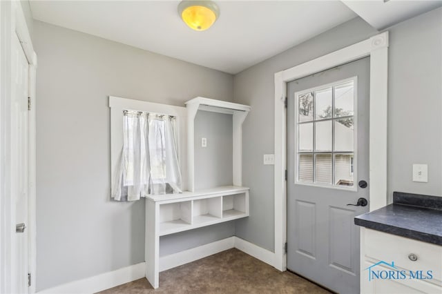 118 Allen Ave, Findlay, OH 45840 - doorway featuring dark colored carpet and baseboards