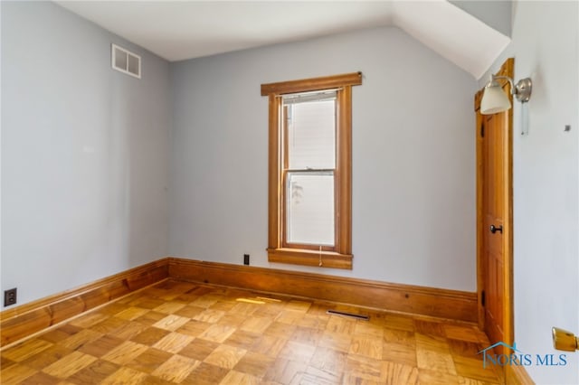 118 Allen Ave, Findlay, OH 45840 - spare room featuring baseboards and lofted ceiling