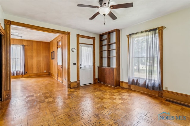 118 Allen Ave, Findlay, OH 45840 - foyer entrance with ceiling fan, healthy amount of natural light, and wood walls