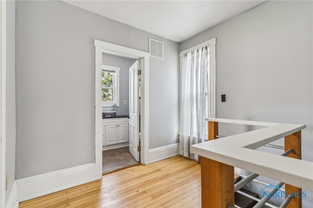 118 Allen Ave, Findlay, OH 45840 - hall featuring light wood-type flooring and an upstairs landing