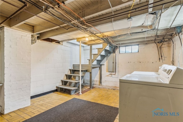 118 Allen Ave, Findlay, OH 45840 - basement with washing machine and clothes dryer, stairway, electric panel, and brick patterned flooring