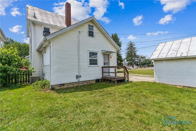 118 Allen Ave, Findlay, OH 45840 - rear view of house featuring a chimney and a yard