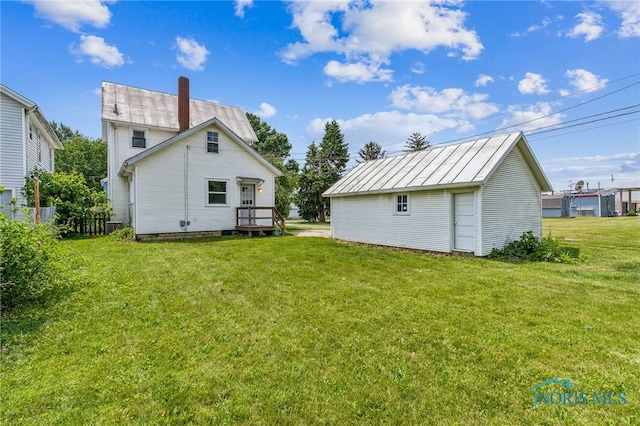 118 Allen Ave, Findlay, OH 45840 - back of property featuring a chimney, an outbuilding, and a metal roof