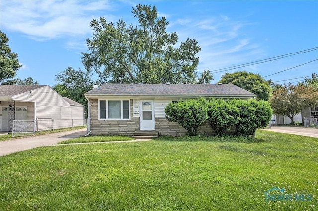 3913 Mcgregor Ln, Toledo, OH 43623 - view of front facade featuring entry steps, stone siding, and concrete driveway
