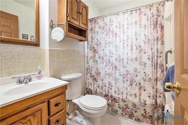 3913 Mcgregor Ln, Toledo, OH 43623 - bathroom with vanity, a wainscoted wall, curtained shower, and tile walls