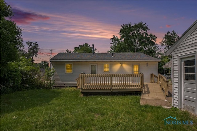 3913 Mcgregor Ln, Toledo, OH 43623 - back of house at dusk featuring a yard and a deck