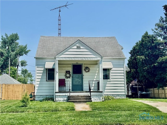 806 Evesham Ave, Toledo, OH 43607 - bungalow-style house with a shingled roof and a porch