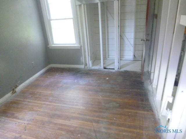 2160 Marlow Rd, Toledo, OH 43613 - unfurnished bedroom with baseboards and wood finished floors