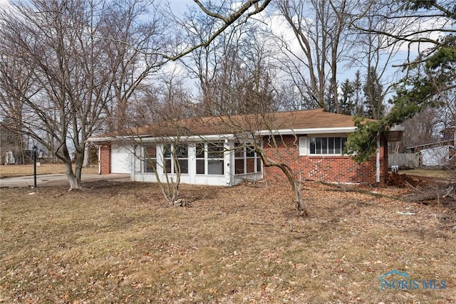 922 Park St, Napoleon, OH 43545 - view of front of property featuring brick siding and an attached garage