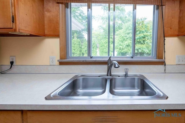 1527 Lockwood Rd, Findlay, OH 45840 - kitchen with light countertops and brown cabinetry