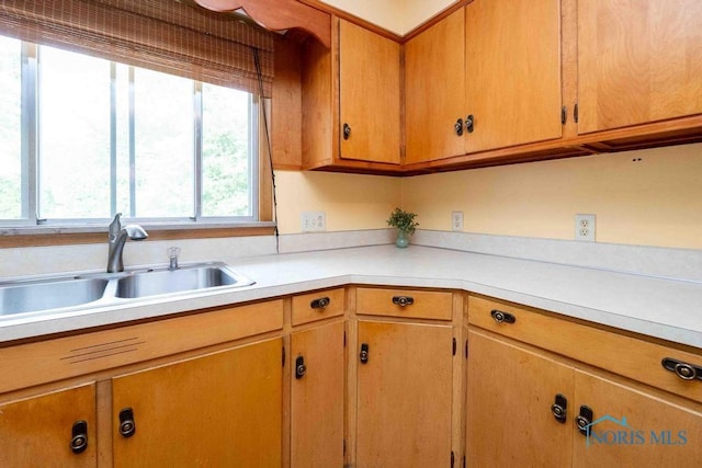 1527 Lockwood Rd, Findlay, OH 45840 - kitchen with light countertops and brown cabinets