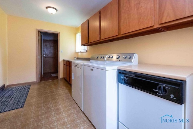 1527 Lockwood Rd, Findlay, OH 45840 - laundry room with washing machine and dryer, light flooring, and cabinet space