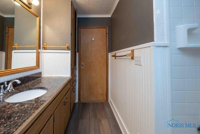 1527 Lockwood Rd, Findlay, OH 45840 - full bath with ornamental molding, vanity, wood finished floors, and a wainscoted wall