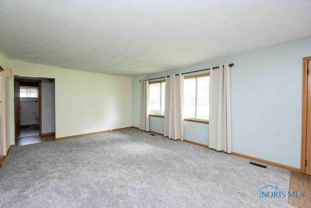 1527 Lockwood Rd, Findlay, OH 45840 - spare room with baseboards and carpet floors
