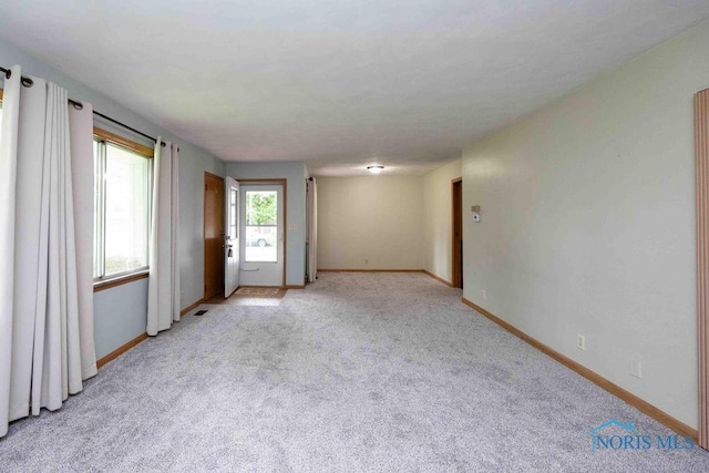 1527 Lockwood Rd, Findlay, OH 45840 - empty room featuring light colored carpet and baseboards