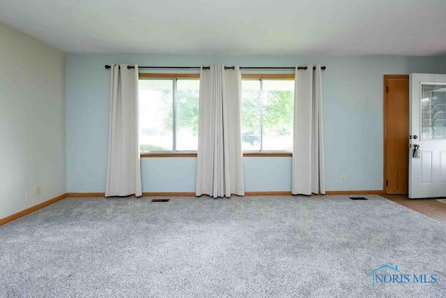 1527 Lockwood Rd, Findlay, OH 45840 - carpeted empty room with healthy amount of natural light