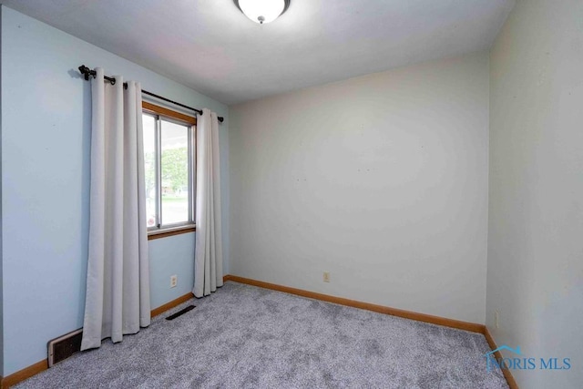 1527 Lockwood Rd, Findlay, OH 45840 - unfurnished room featuring light colored carpet and baseboards