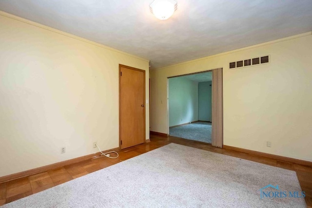 1527 Lockwood Rd, Findlay, OH 45840 - spare room featuring ornamental molding and carpet flooring