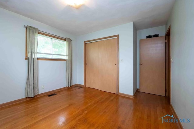 1527 Lockwood Rd, Findlay, OH 45840 - unfurnished bedroom featuring light wood-style floors and a closet