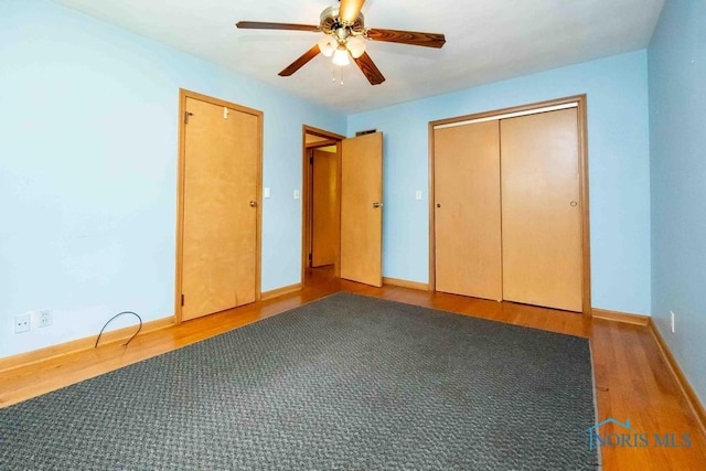 1527 Lockwood Rd, Findlay, OH 45840 - unfurnished bedroom with wood finished floors and ceiling fan