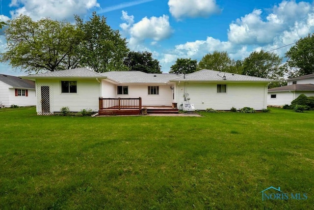 1527 Lockwood Rd, Findlay, OH 45840 - back of house with a wooden deck and a lawn